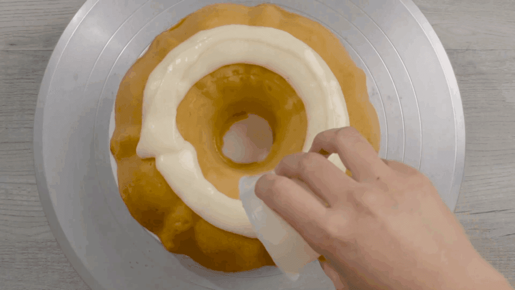Bundt cake at ambient temperature where glaze is being applied