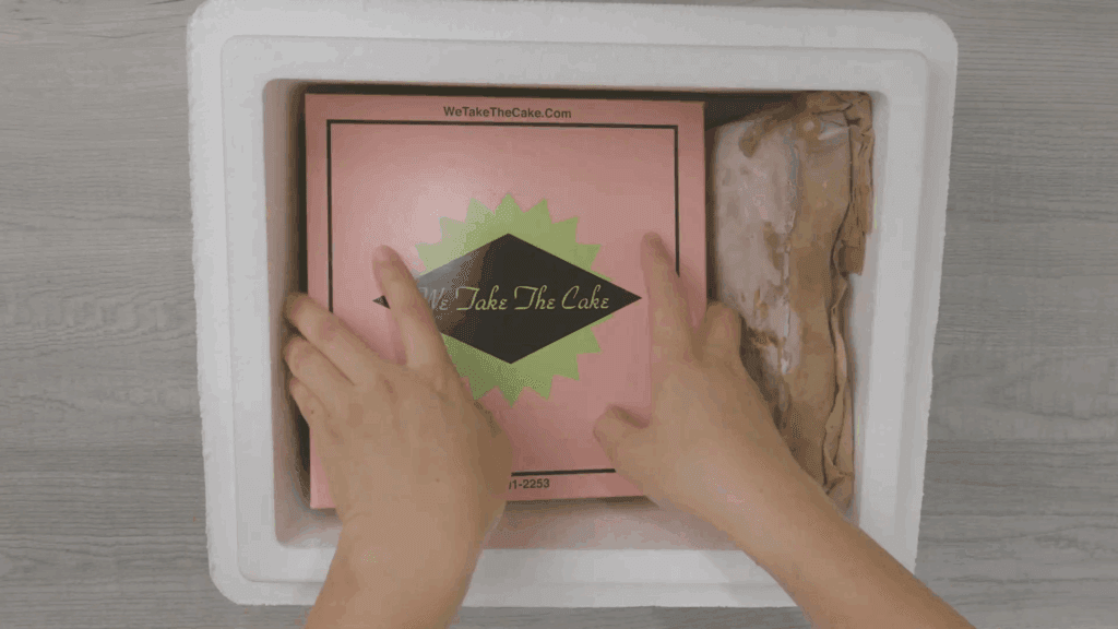 Packing up layer cake with dry ice ready for nationwide shipping